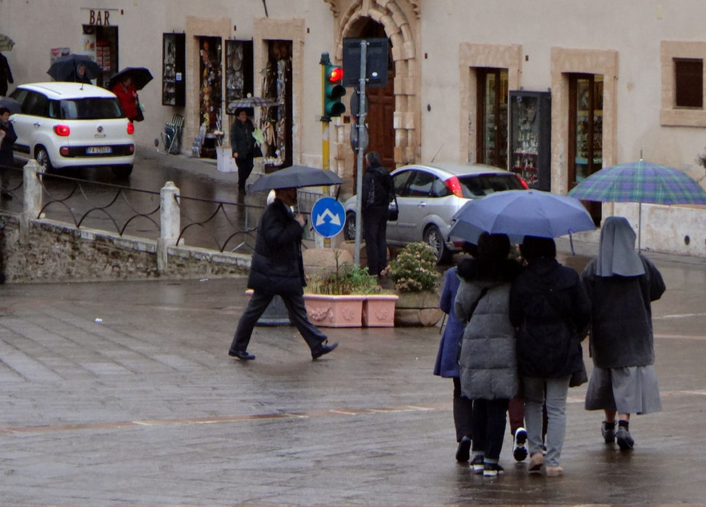 Tourists in the rain. Assissi, Italy 2016