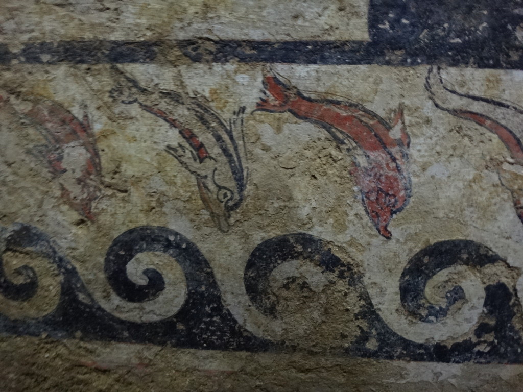 The diving dolphins represent the human dive into the afterlife. The Etruscans were extraordinary merchants and many took to the sea so they would know dolphins. Museo Civico Archeologico di Sarteano