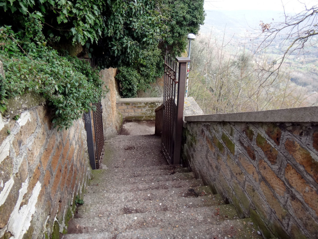 This is the start of the long stairway that leads to the footbridge to Civita. Civita, Italy 2016.