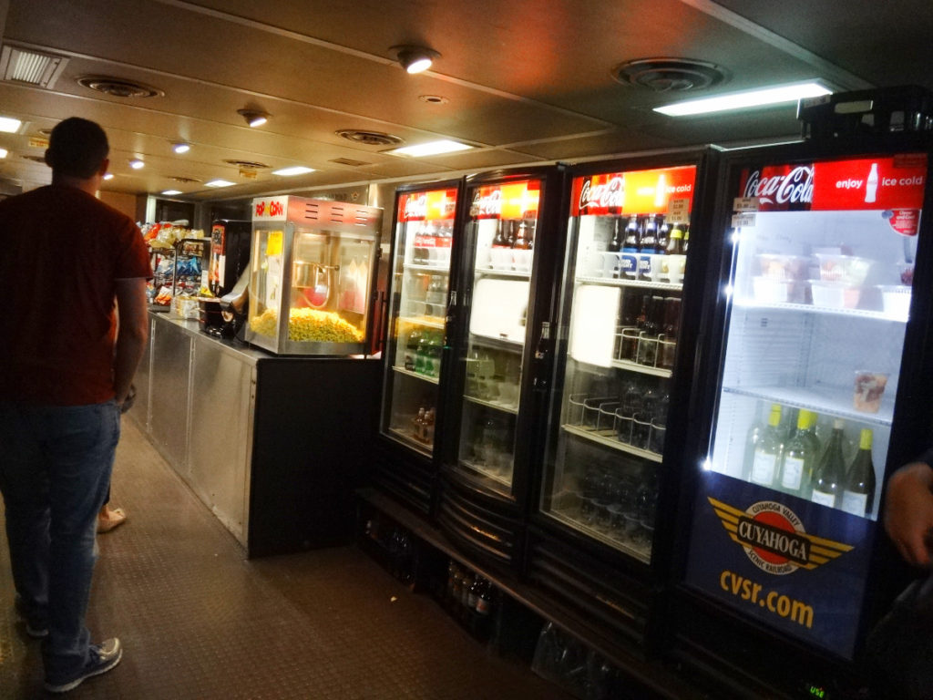 There is a food car on the train where you can buy vending snacks or food at a snack bar. The train also features full breakfast (buy your tickets ahead of time) and frequent dinner trips.