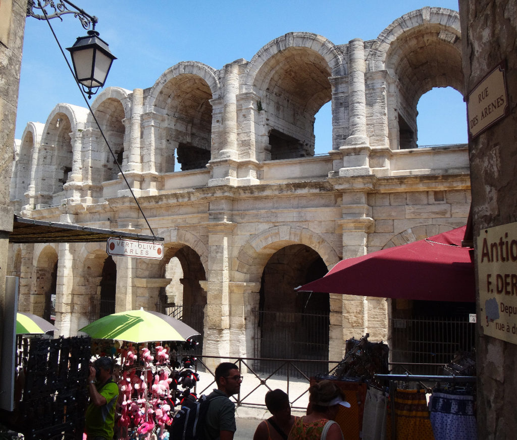 You can see that modern entrepreneurism sits cheek to jowl to the ancient coliseum. Arles, France